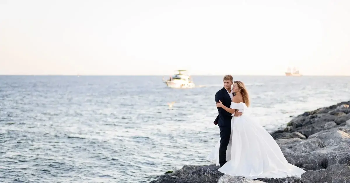 Bride and groom waterfront wedding portraits